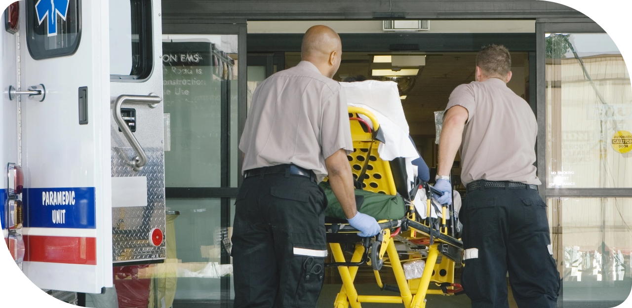 Paramedics unloading a patient from an ambulance